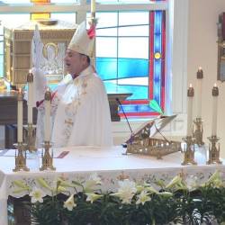 A bishop wearing a white Pontifical vest