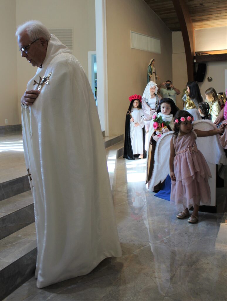 A group of kids wearing religious costumes, such as angel, Mary, and more