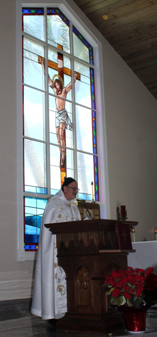 A priest in the pulpit during the mass