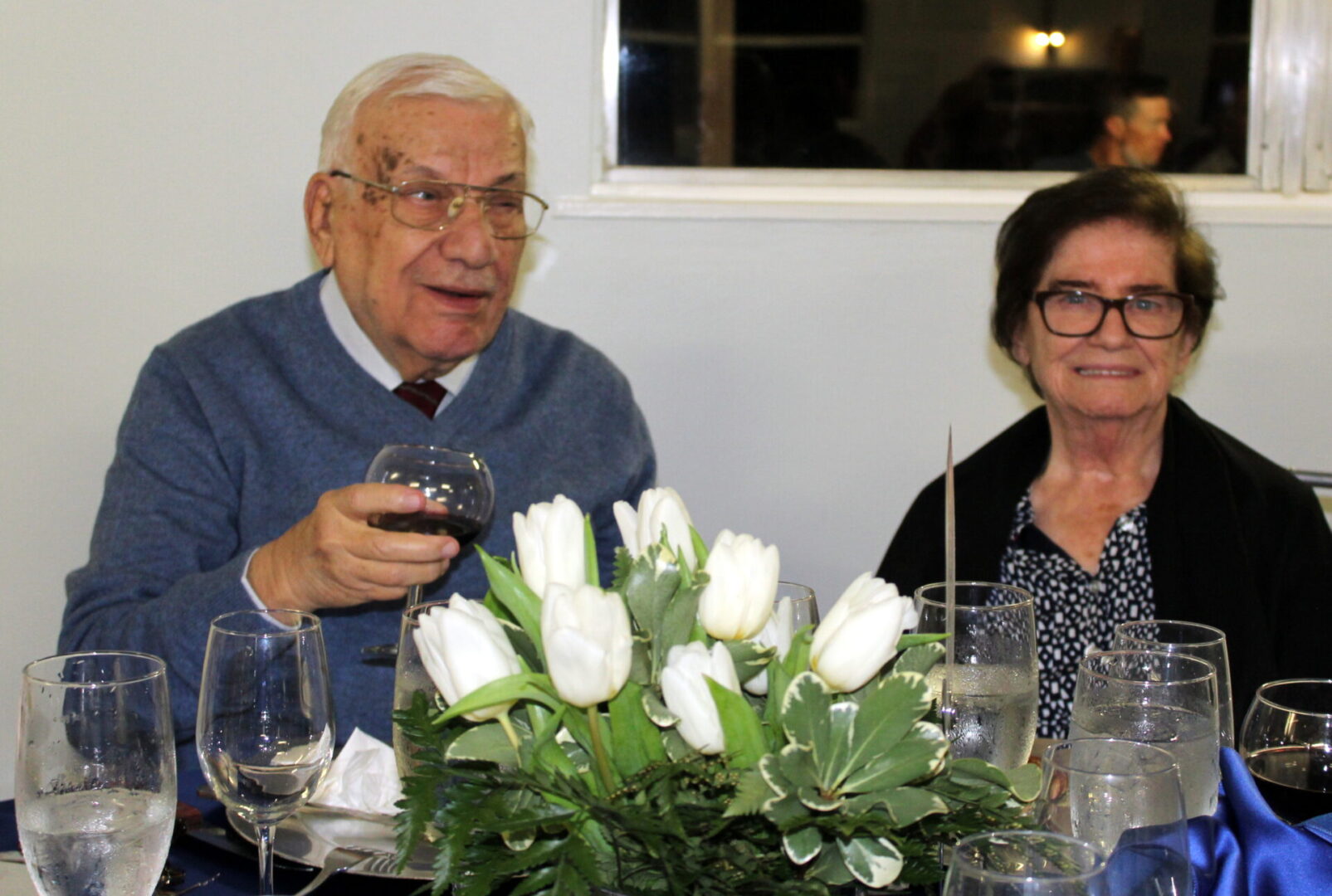 An old couple wearing eyeglasses