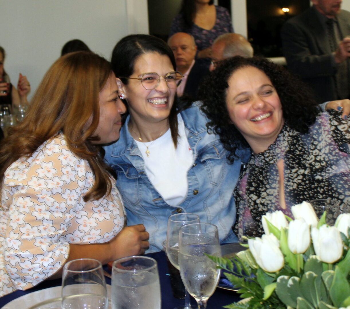 Three women laughing