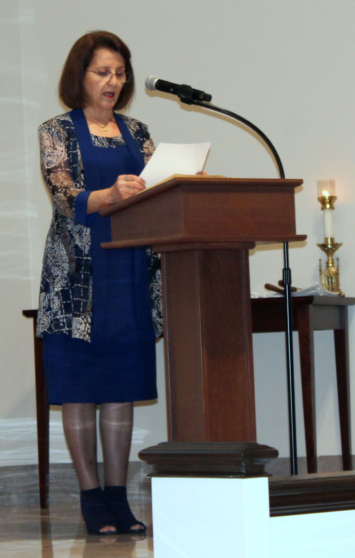 A woman wearing a blue dress