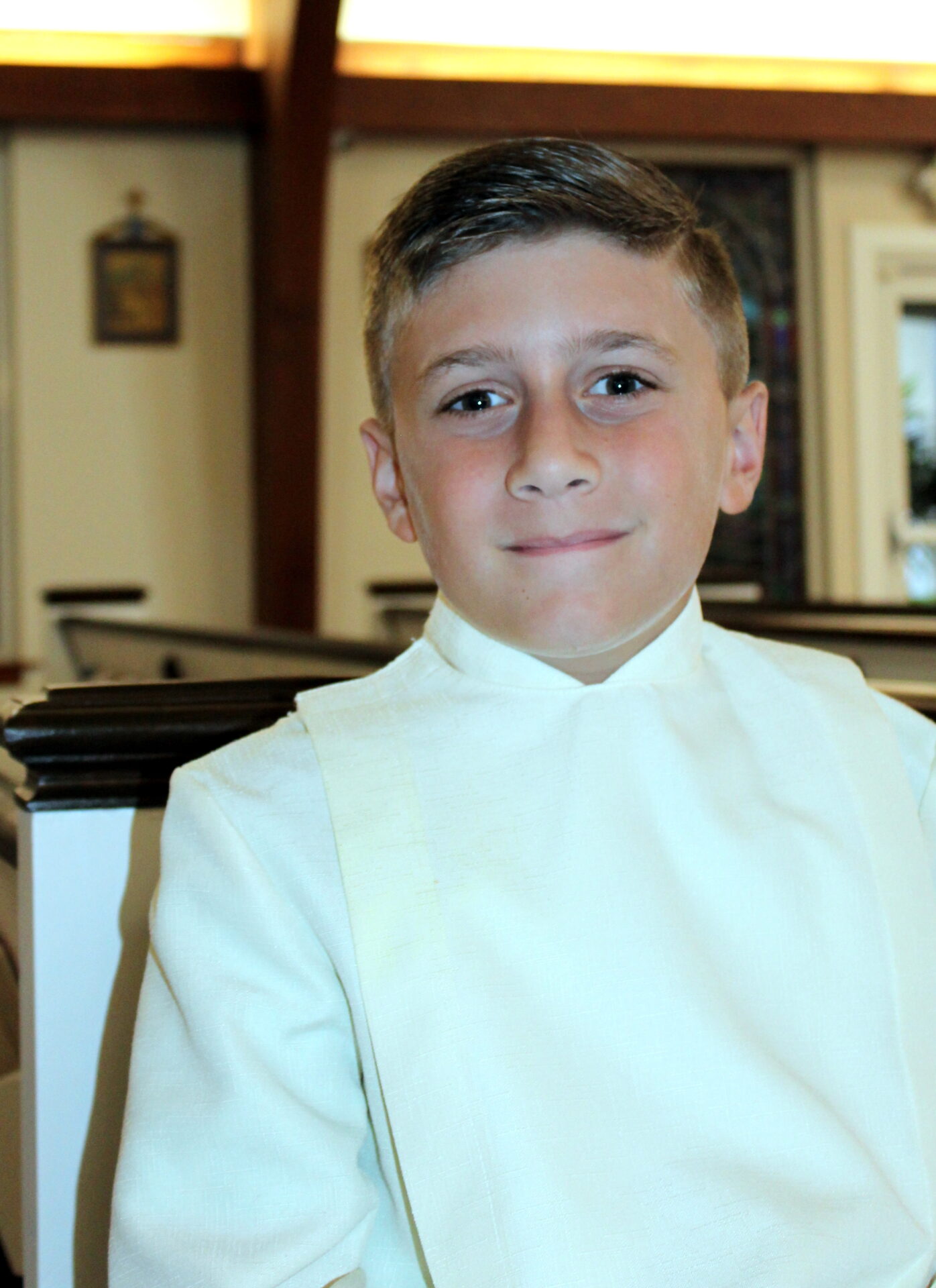 A young boy with medium blonde hair