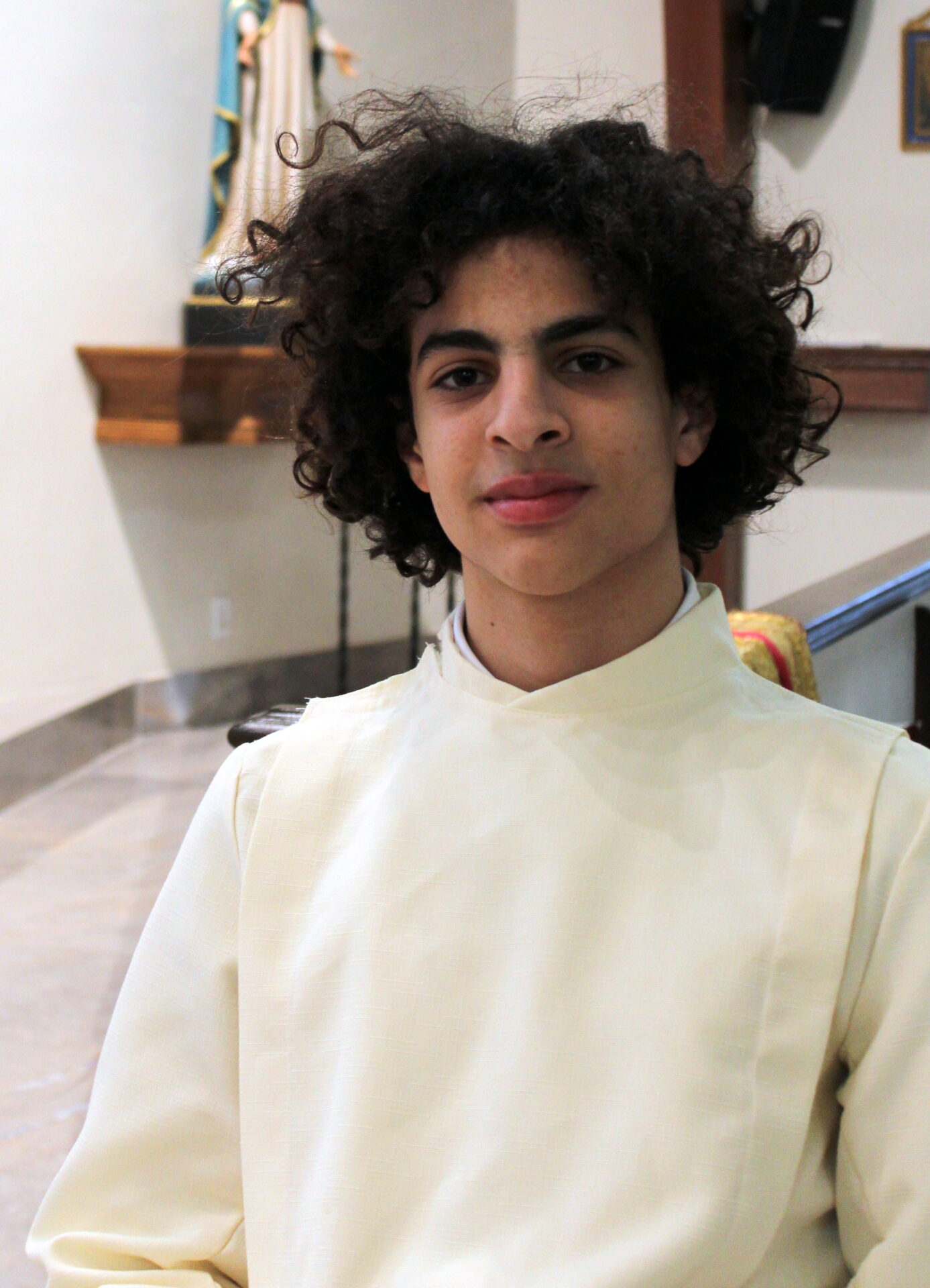 A young boy with curly hair