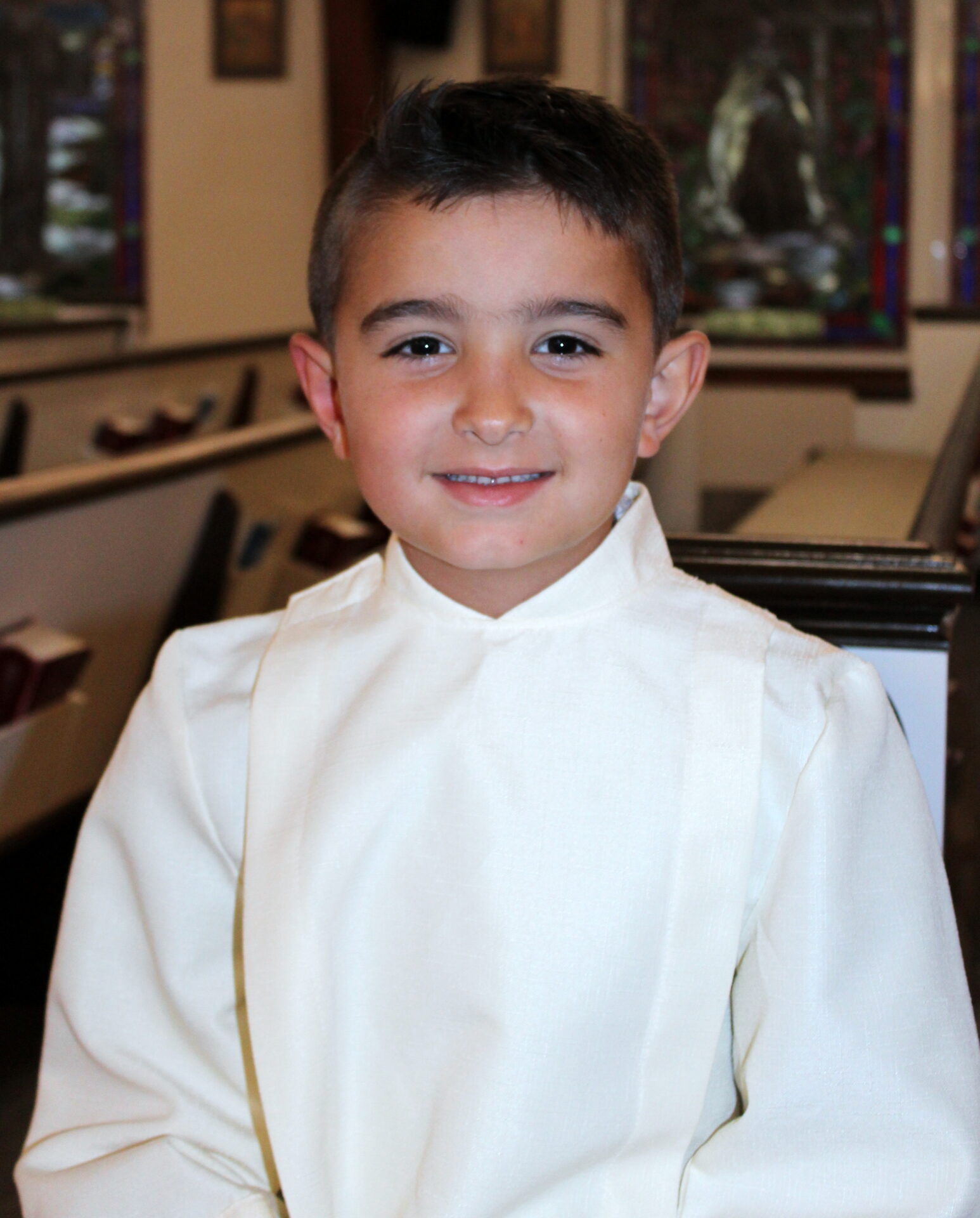 A young boy with medium dark blonde hair