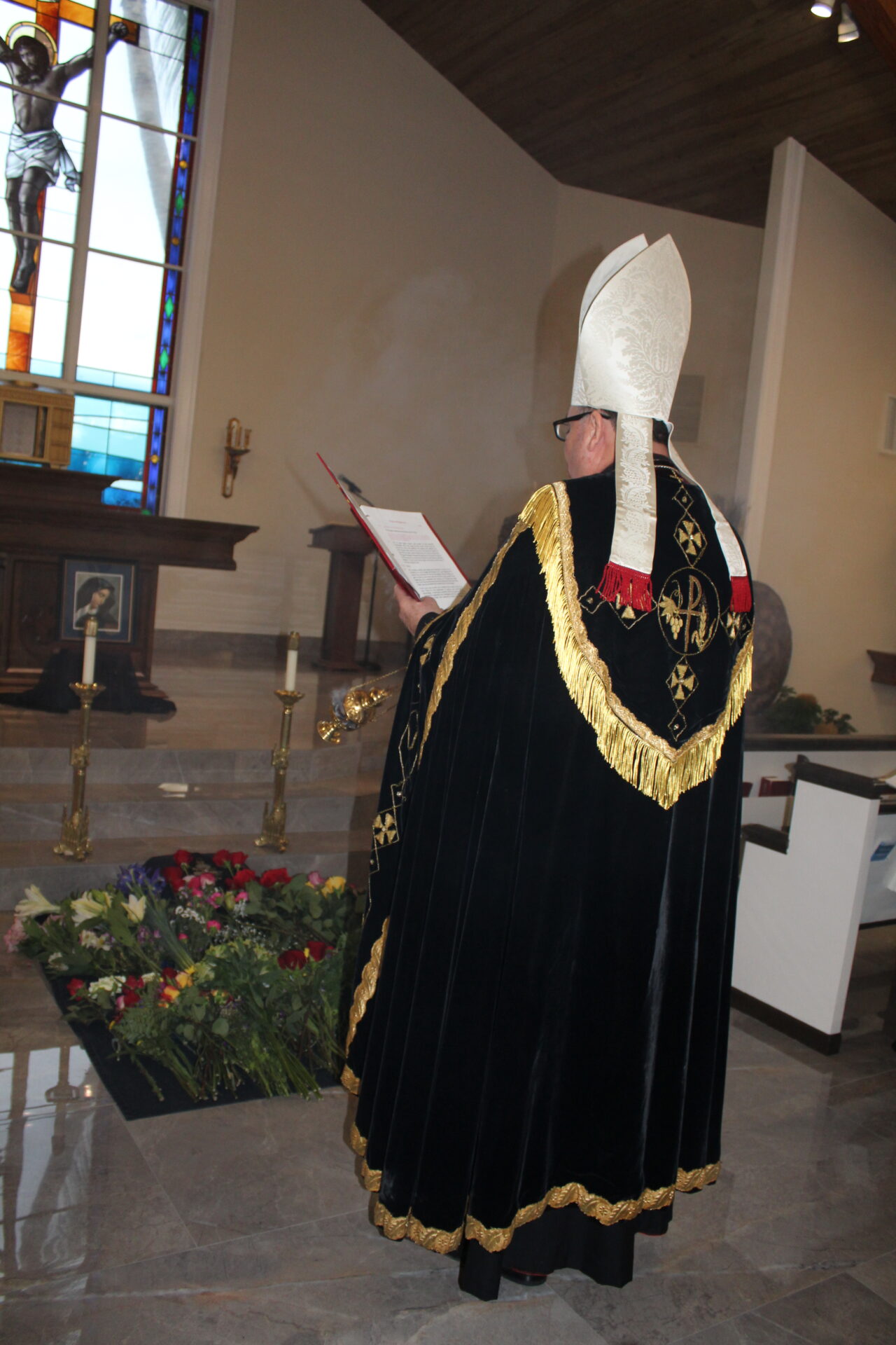 A bishop wearing black best