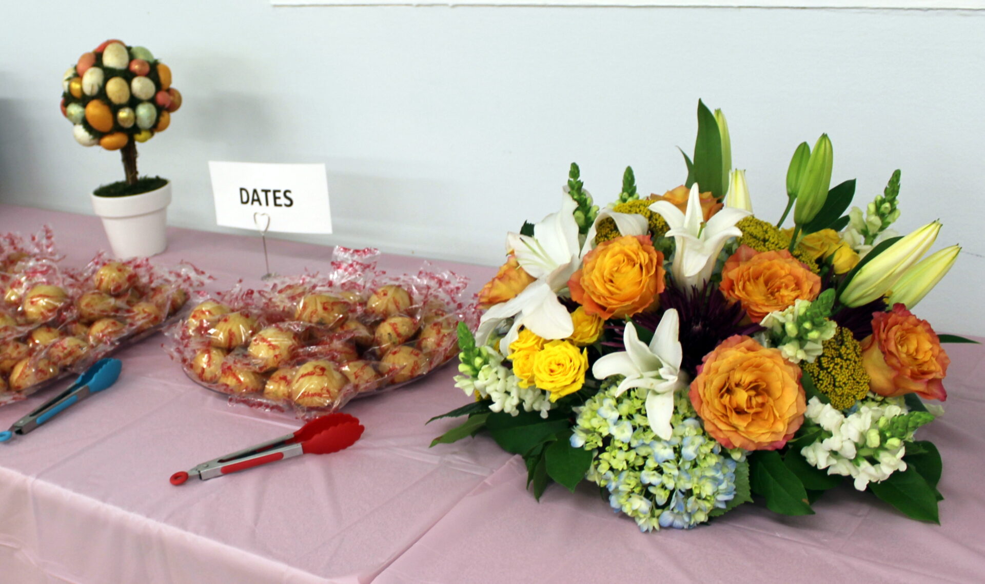 A table with dates and a bunch of flowers