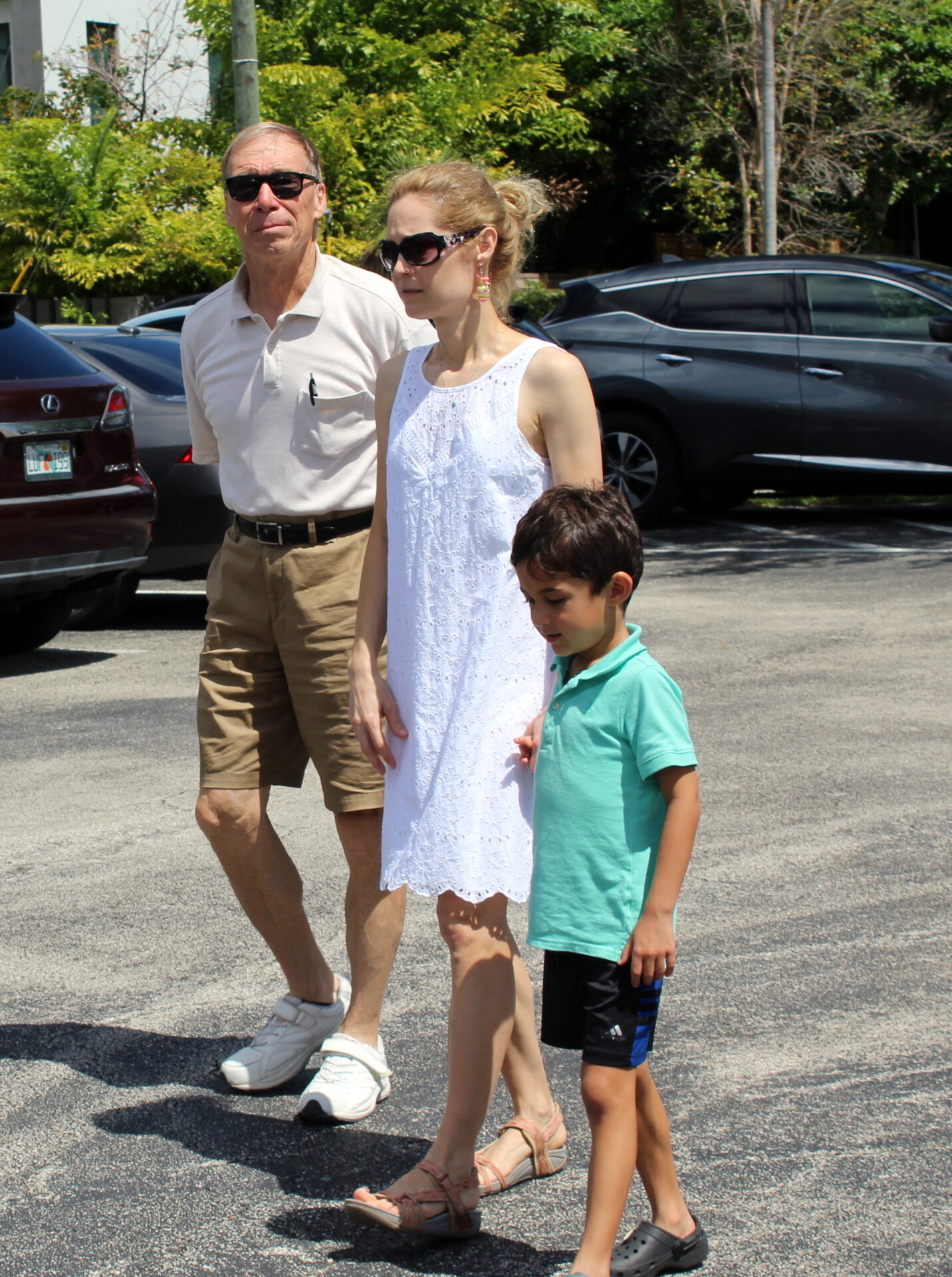 A family wearing white top