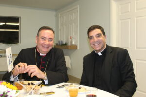 Two church people wearing black suits